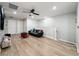 Spacious loft area with a couch and wood-look floors at 4626 Terrasonesta Dr, Davenport, FL 33837