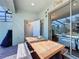 Outdoor patio with table, bench, and access to a small bathroom at 4626 Terrasonesta Dr, Davenport, FL 33837