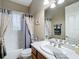 Clean bathroom with a shower/tub combo and updated vanity at 542 Viterra Ct, Kissimmee, FL 34759