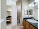 Elegant bathroom with double vanity, granite counters, and separate toilet area at 542 Viterra Ct, Kissimmee, FL 34759