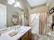 Elegant bathroom with a bathtub, updated vanity, and neutral color scheme at 542 Viterra Ct, Kissimmee, FL 34759