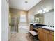 Elegant bathroom with a soaking tub, walk-in shower, and double vanity at 542 Viterra Ct, Kissimmee, FL 34759