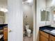 Small bathroom with toilet and view of another bathroom at 542 Viterra Ct, Kissimmee, FL 34759