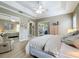 Main bedroom with a king-size bed and access to a private patio at 542 Viterra Ct, Kissimmee, FL 34759