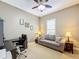 Bright home office features a desk, comfortable couch, and ample natural light at 542 Viterra Ct, Kissimmee, FL 34759