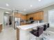 Modern kitchen with stainless steel appliances and light oak cabinetry at 542 Viterra Ct, Kissimmee, FL 34759