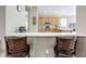 Kitchen with a breakfast bar and view into the main living area at 542 Viterra Ct, Kissimmee, FL 34759