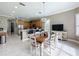Bright kitchen with island, stainless steel appliances, and breakfast nook at 542 Viterra Ct, Kissimmee, FL 34759