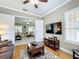 Living room with hardwood floors and view into Gathering room at 542 Viterra Ct, Kissimmee, FL 34759