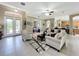 Spacious living area with tile floors, comfy sofas, and built-in shelving at 542 Viterra Ct, Kissimmee, FL 34759