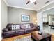 Relaxing living room featuring a brown leather sofa and wood coffee table at 542 Viterra Ct, Kissimmee, FL 34759