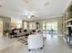 Spacious living area with tile floors, comfy sofas, and built-in shelving at 542 Viterra Ct, Kissimmee, FL 34759