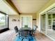 Screened porch with brick pavers and sliding doors leading inside at 542 Viterra Ct, Kissimmee, FL 34759