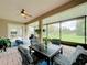 Spacious screened porch with patio furniture and view of the backyard at 542 Viterra Ct, Kissimmee, FL 34759