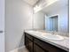 Double vanity bathroom with dark brown cabinets and granite countertop at 627 Lucerne Blvd, Winter Haven, FL 33881