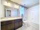Bathroom with double vanity, tub, and neutral decor at 627 Lucerne Blvd, Winter Haven, FL 33881