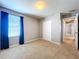 Bedroom with carpet, window, and double doors at 627 Lucerne Blvd, Winter Haven, FL 33881