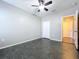 Simple bedroom with dark flooring and a ceiling fan at 627 Lucerne Blvd, Winter Haven, FL 33881