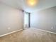 Spacious bedroom with neutral walls, carpeted floor, and window at 627 Lucerne Blvd, Winter Haven, FL 33881