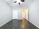 Simple bedroom with dark flooring and a ceiling fan at 627 Lucerne Blvd, Winter Haven, FL 33881