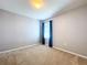 Bedroom with carpet, window, and blue curtains at 627 Lucerne Blvd, Winter Haven, FL 33881