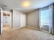 Bedroom with carpet, window, and closet at 627 Lucerne Blvd, Winter Haven, FL 33881