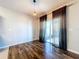 Well-lit dining area with hardwood floors and sliding glass doors to the outdoors at 627 Lucerne Blvd, Winter Haven, FL 33881