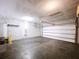 Attached garage with concrete floor at 627 Lucerne Blvd, Winter Haven, FL 33881