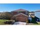 Two-story house with attached garage at 627 Lucerne Blvd, Winter Haven, FL 33881
