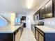 Open concept kitchen with stainless steel appliances and island at 627 Lucerne Blvd, Winter Haven, FL 33881