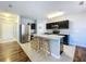 Modern kitchen with stainless steel appliances and breakfast bar at 627 Lucerne Blvd, Winter Haven, FL 33881