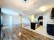 Modern kitchen with island, stainless steel appliances, and dark cabinets at 627 Lucerne Blvd, Winter Haven, FL 33881