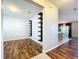 Open concept living area with hardwood floors and built-in shelving at 627 Lucerne Blvd, Winter Haven, FL 33881