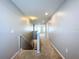 Upstairs hallway with neutral walls, carpet, and stairway at 627 Lucerne Blvd, Winter Haven, FL 33881