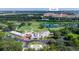 Aerial view of golf club, nearby hospital, and green landscape at 720 Siena Palm Dr # 202, Celebration, FL 34747