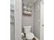 Clean bathroom with toilet, shower, and floating shelf at 720 Siena Palm Dr # 202, Celebration, FL 34747