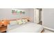 Main bedroom with king-size bed and en-suite bathroom access at 720 Siena Palm Dr # 202, Celebration, FL 34747