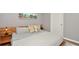 King-size bed in a nicely decorated main bedroom at 720 Siena Palm Dr # 202, Celebration, FL 34747