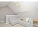 Bright bonus room featuring an L-shaped sofa and ceiling fan at 720 Siena Palm Dr # 202, Celebration, FL 34747