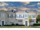 Two-story townhome with gray shutters and a neutral color scheme at 720 Siena Palm Dr # 202, Celebration, FL 34747