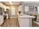 Modern kitchen with white cabinets and stainless steel appliances at 720 Siena Palm Dr # 202, Celebration, FL 34747