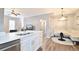 Modern kitchen with white cabinets and breakfast bar at 720 Siena Palm Dr # 202, Celebration, FL 34747