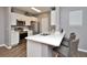 Modern kitchen with white cabinets and stainless steel appliances at 720 Siena Palm Dr # 202, Celebration, FL 34747