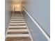 Modern staircase with wood and white accents at 720 Siena Palm Dr # 202, Celebration, FL 34747