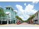 Quaint town square with shops and palm trees lining the street at 720 Siena Palm Dr # 202, Celebration, FL 34747