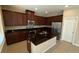 Modern kitchen with granite countertops and stainless steel appliances at 9107 Reflection Pointe Dr, Windermere, FL 34786