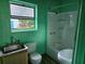 Updated bathroom with a tub, shower, and single vanity at 1420 Ne 22Nd St, Ocala, FL 34470