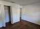Bedroom with wood-look floors and a louvered closet at 1420 Ne 22Nd St, Ocala, FL 34470