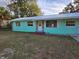 Recently painted teal single-story home with stone accents at 1420 Ne 22Nd St, Ocala, FL 34470