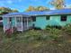 Mint green house exterior with a covered porch at 1420 Ne 22Nd St, Ocala, FL 34470